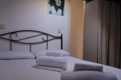Cama o camas de una habitación en COZY ROMANTIC MALASAÑA