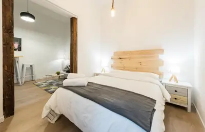 Cama o camas de una habitación en El Encanto de Malasaña