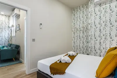 Cama o camas de una habitación en Waou Malasaña III - Alquiler Corta Duración