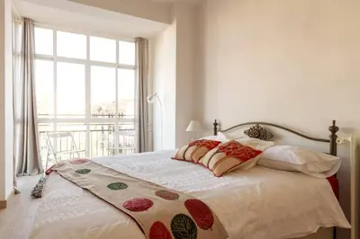 Cama o camas de una habitación en Maravilloso Apartamento en Puerta de Toledo C/Gasómetro by Batuecas