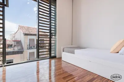 Cama o camas de una habitación en Chueca Apartments - Dúplex en el Centro de Madrid