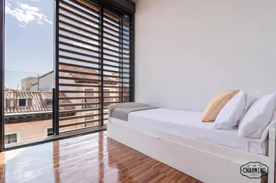 Cama o camas de una habitación en Chueca Apartments - Dúplex en el Centro de Madrid