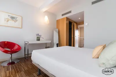 Cama o camas de una habitación en Chueca Apartments - Dúplex en el Centro de Madrid