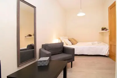 Cama o camas de una habitación en Estupendo Apartamento junto a Estación de Atocha by Batuecas