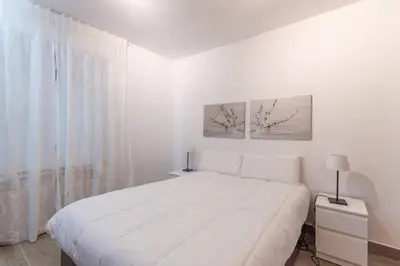 Cama o camas de una habitación en Alojamiento temporal en Malasaña