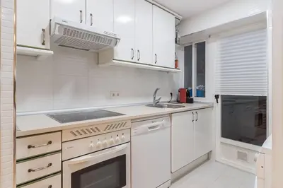 Una cocina o zona de cocina en Alojamiento temporal en Malasaña