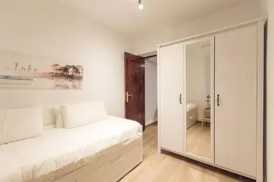 Cama o camas de una habitación en Alojamiento temporal en Malasaña