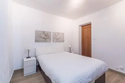 Cama o camas de una habitación en Alojamiento temporal en Malasaña