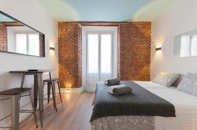Cama o camas de una habitación en ººPS New Atocha Studio ºº