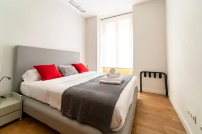 Cama o camas de una habitación en Morar Apartments Malasaña
