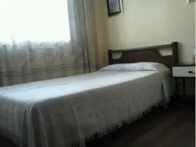 Cama o camas de una habitación en Hostal Suárez