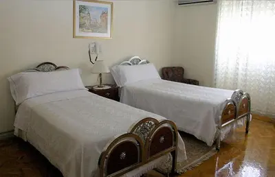 Cama o camas de una habitación en Hostal Delfina