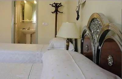 Cama o camas de una habitación en Hostal Delfina