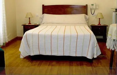 Cama o camas de una habitación en Hostal Delfina