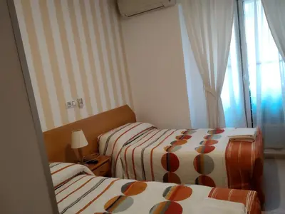 Cama o camas de una habitación en Pension Dominguez