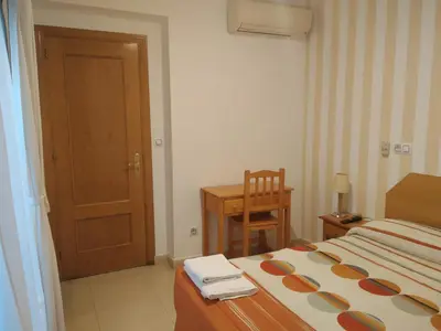 Cama o camas de una habitación en Pension Dominguez