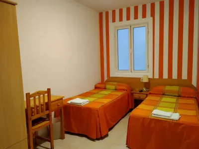 Cama o camas de una habitación en Pension Dominguez