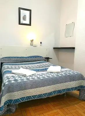 Cama o camas de una habitación en Hostal Los Arcos