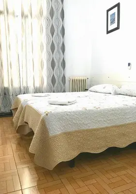 Cama o camas de una habitación en Hostal Los Arcos