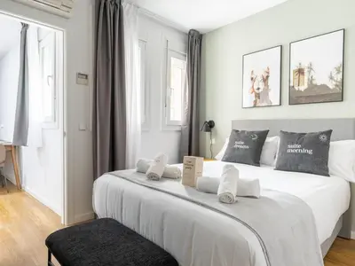 Cama o camas de una habitación en Limehome Madrid La Bolsa