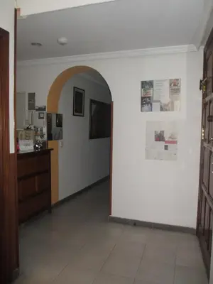 Una televisión o centro de entretenimiento en Hostal Pan America