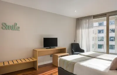 Una televisión o centro de entretenimiento en Gran View Apartments