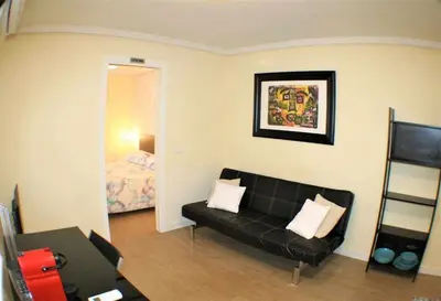 Zona de estar de Apartamento cercano a Madrid Rio céntrico. Nuevo