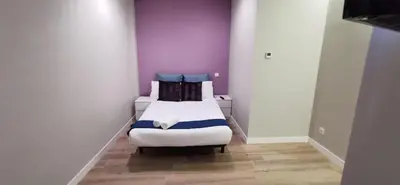 Cama o camas de una habitación en Apartamentos Sol Madrid