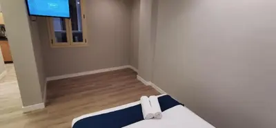 Una televisión o centro de entretenimiento en Apartamentos Sol Madrid