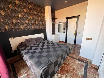 Cama o camas de una habitación en Apartamentos El Tiempo