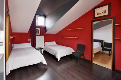 Cama o camas de una habitación en Apartamentos El Tiempo