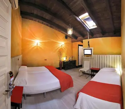 Cama o camas de una habitación en Apartamentos El Tiempo