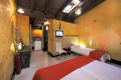 Cama o camas de una habitación en Apartamentos El Tiempo