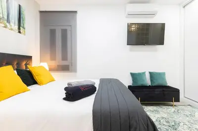 Cama o camas de una habitación en Madrid Río Apartment