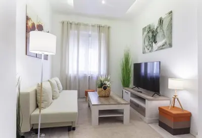 Una televisión o centro de entretenimiento en Artes Exclusive en Madrid
