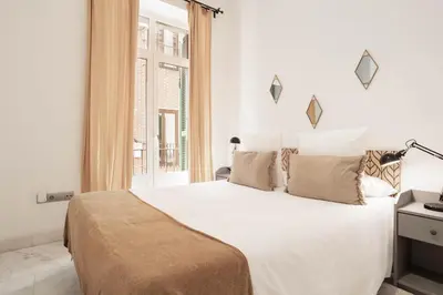 Cama o camas de una habitación en Echegaray en Madrid