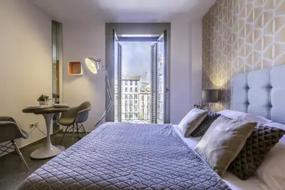 Cama o camas de una habitación en Santa Ana Boutique en Madrid
