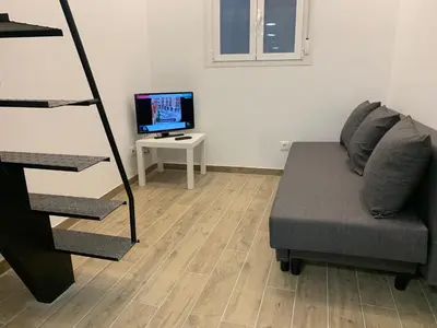 Una televisión o centro de entretenimiento en Piso céntrico y funcional