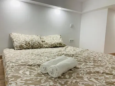 Cama o camas de una habitación en Piso céntrico y funcional
