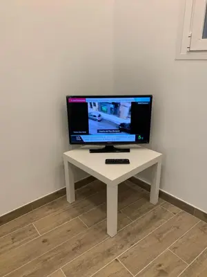 Una televisión o centro de entretenimiento en Piso céntrico y funcional