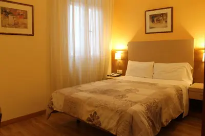 Cama o camas de una habitación en Hotel Mirador Puerta del Sol