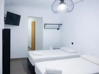 Cama o camas de una habitación en Hostal Andrea