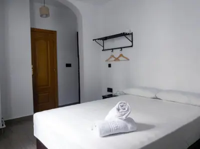 Cama o camas de una habitación en Hostal Andrea