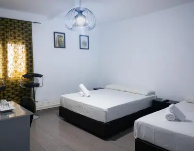 Cama o camas de una habitación en Hostal Andrea
