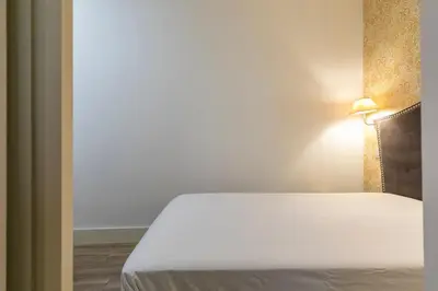 Cama o camas de una habitación en HOMEABOUT DIEGO DE LEÓN Apartment I