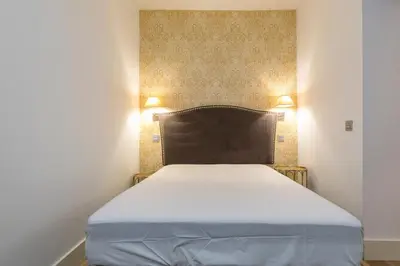 Cama o camas de una habitación en HOMEABOUT DIEGO DE LEÓN Apartment I