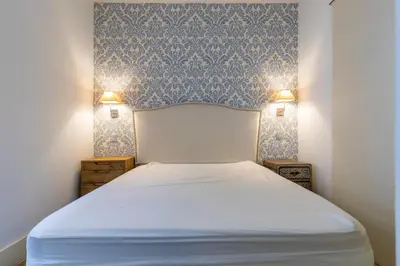 Cama o camas de una habitación en HOMEABOUT DIEGO DE LEÓN Apartment I