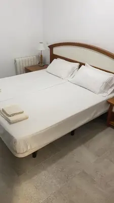 Cama o camas de una habitación en Aloja Madrid