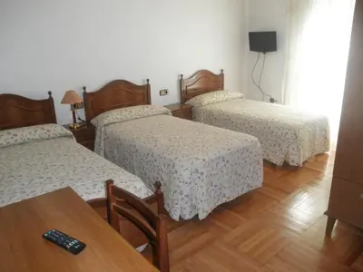Cama o camas de una habitación en Hostal Los Andes