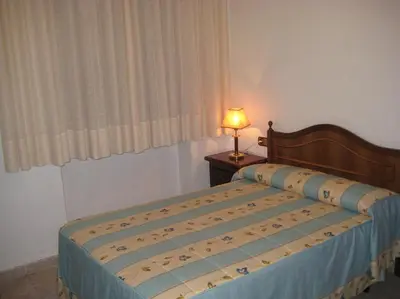 Cama o camas de una habitación en Hostal Los Andes